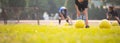 Asian child girl exercise warm up before play soccer with coach and friend. Royalty Free Stock Photo