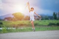 Asian child girl and father with a kite running and happy on meadow in summer in nature Royalty Free Stock Photo