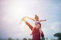 Asian child girl and father with a kite running and happy on meadow in summer in nature Royalty Free Stock Photo