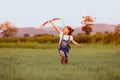 Asian child girl and father with a kite running and happy on meadow in summer in nature Royalty Free Stock Photo