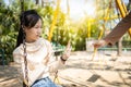 Asian child girl gesturing hand stop with no to drink milk or bored of food, female teenage refused a glass of milk, daughter