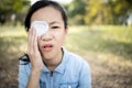 Asian child girl has a blindfolded bandaged eye,female people cover with blindfolded to protect against dust or redness,feel pain,