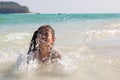 Asian child girl having fun to play water in the beautiful sea in summer vacation Royalty Free Stock Photo