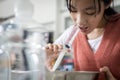 Asian child girl having stuffy nose,difficulty breathing,nasal wash,nose cleaning with syringe and saline,nasal sinus infection, Royalty Free Stock Photo