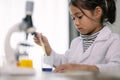 Asian child girl learning science chemistry with test tube making experiment at school laboratory. education, science, chemistry, Royalty Free Stock Photo