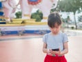 Asian child girl play smart phone Royalty Free Stock Photo