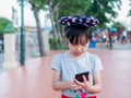 Asian child girl play smart phone Royalty Free Stock Photo