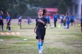 Asian child girl running and exercise warm up before play soccer in the field. Royalty Free Stock Photo