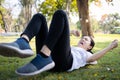 Asian child girl running,falling down or slipping,injuring her back,mischievous female people who suffered an accident due to Royalty Free Stock Photo