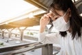 Asian child girl suffer from headache with the weather is very hot and air pollution,allergy to dust, feel sick,dizzy,fainting, Royalty Free Stock Photo