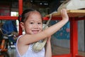 Asian child girl talking on the retro telephone Royalty Free Stock Photo