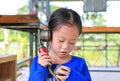 Asian child girl talking on the retro telephone Royalty Free Stock Photo