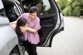 Asian child girl about to throw up from car sick or indigestion,female teenage vomiting in a car suffers from motion sickness,