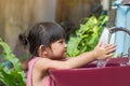 Asian child girl washing his hands before eating food Royalty Free Stock Photo