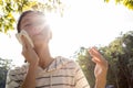 Asian child girl wiping sweat on her face with tissue paper suffer from sunburn very hot in summer weather problem feel faint, Royalty Free Stock Photo