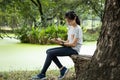 Asian child girl writing message on sheet of white paper in clipboard to vent her feelings,reduce stress,rage, female people have