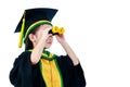 Asian child in graduation gown using binoculars with copy space. Royalty Free Stock Photo