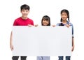 Asian child holds blank sign. Teen boy and girl holds empty billboard