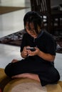 Asian child little girl playing game on mobile phone.  Communication concept Royalty Free Stock Photo