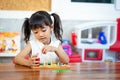 Child little girl playing wooden toys Royalty Free Stock Photo