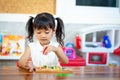 Child little girl playing wooden toys Royalty Free Stock Photo