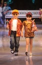 Asian child model at fashion show runway