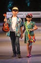 Asian child model at fashion show runway