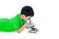 Asian child observed through a microscope biological preparation