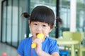 Asian Child playing plastic microphone at the kid room Royalty Free Stock Photo