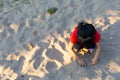 Asian child playing with sand in the playground Royalty Free Stock Photo