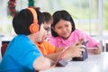 Asian child playing tablet computer together Royalty Free Stock Photo