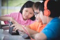 Asian child playing tablet computer together Royalty Free Stock Photo