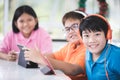 Asian child playing tablet computer together Royalty Free Stock Photo