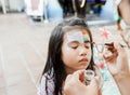 asian Child preschooler with face painting. Make up. Royalty Free Stock Photo