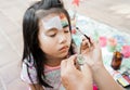 asian Child preschooler with face painting. Make up.