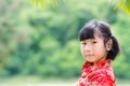 Asian child in traditional Chinese cheongsam