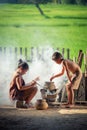 Asian children boy and girl are cooking in the Kitchen of the Co