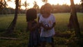 Asian Children Chuckling At Camera - Philippines