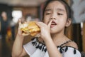 Asian Children eat chicken cheese Hamburger Food Court