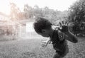 Asian children enjoying rainfall.