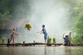 Asian children farmer on rice cross the wood bridge before the g Royalty Free Stock Photo