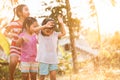 Asian children having fun to play with the rain together