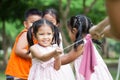 Asian children having fun to play tug-of-war with rope together