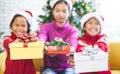 Children holding beautiful gift boxes and giving in Christmas celebration Royalty Free Stock Photo
