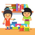 Asian children playing building tower together Royalty Free Stock Photo