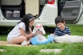 Asian children playing with siberian husky puppy Royalty Free Stock Photo