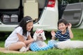 Asian children playing with siberian husky puppy Royalty Free Stock Photo