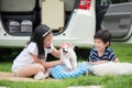 Asian children playing with siberian husky puppy Royalty Free Stock Photo