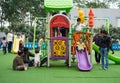 Asian children playing with toys on a playground