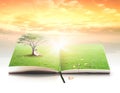 Asian children reading under big tree on book of nature Royalty Free Stock Photo